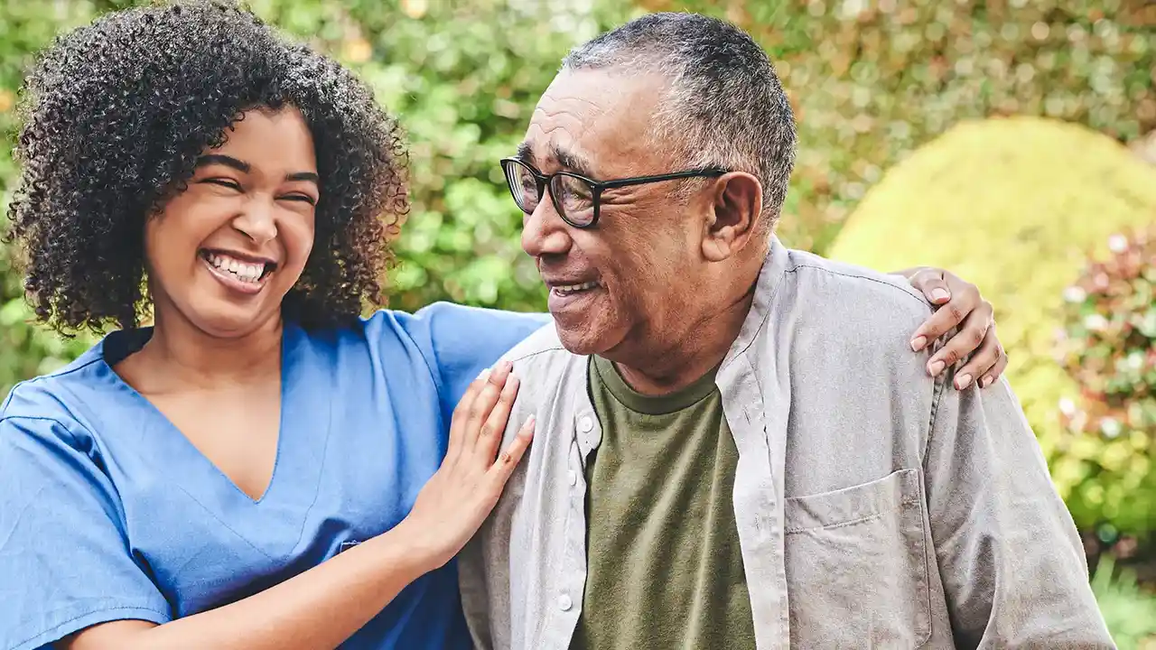 blue bowl of black bean beef tortilla soup on a board with cilantro and shredded cheese in background