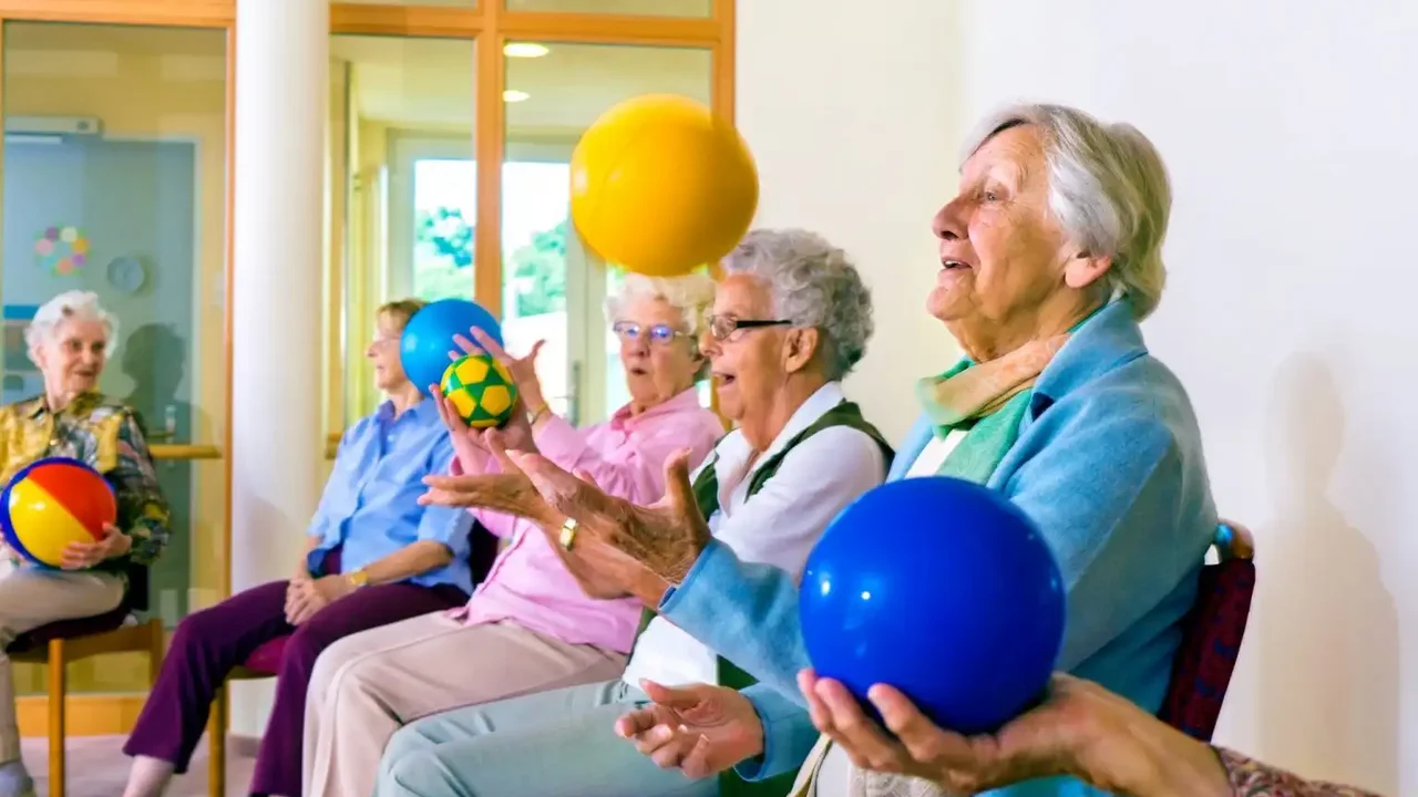 Close up on a plate of mashed potatoes, topped with baked pork chops with cream of mushroom soup, and a side of green beans.