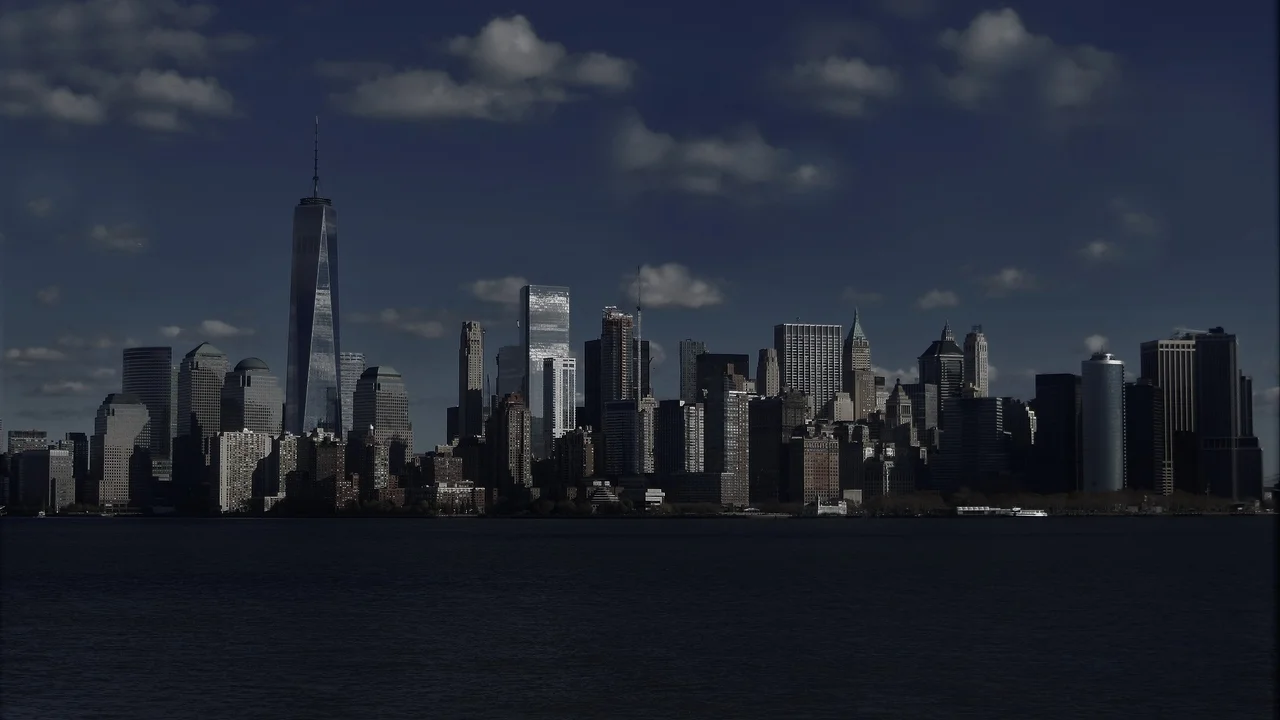 Close up on a plate of mashed potatoes, topped with baked pork chops with cream of mushroom soup, and a side of green beans.