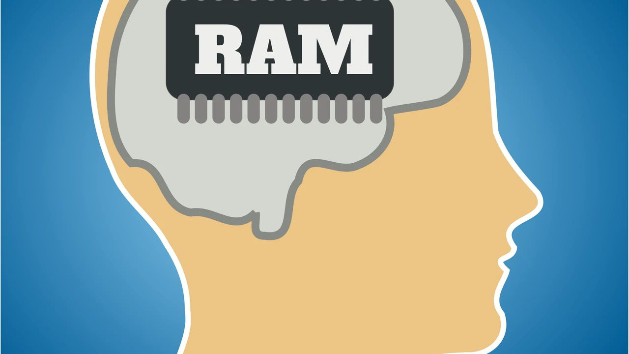 Close up on a plate of mashed potatoes, topped with baked pork chops with cream of mushroom soup, and a side of green beans.