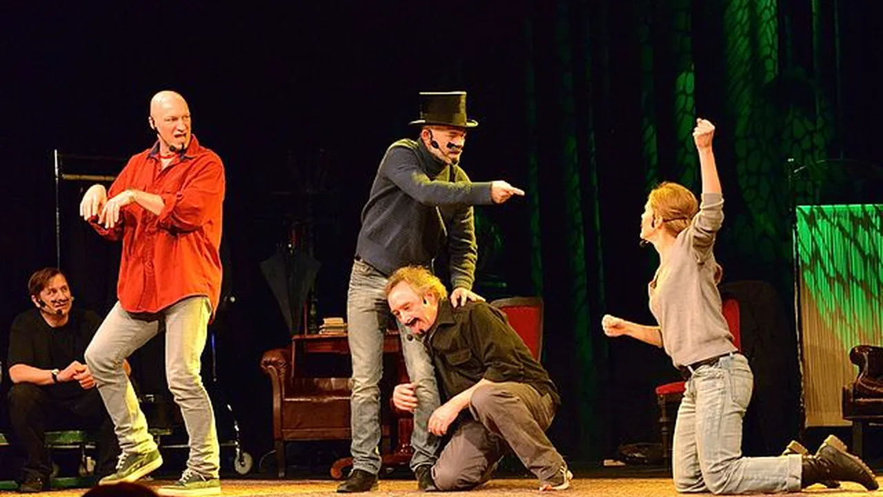 Close up on a plate of mashed potatoes, topped with baked pork chops with cream of mushroom soup, and a side of green beans.