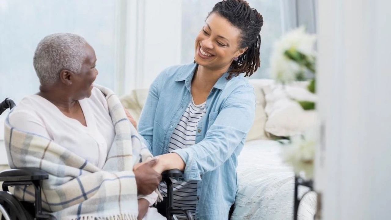 Close up on a plate of mashed potatoes, topped with baked pork chops with cream of mushroom soup, and a side of green beans.