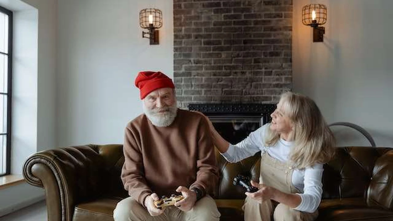 Close up on a plate of mashed potatoes, topped with baked pork chops with cream of mushroom soup, and a side of green beans.